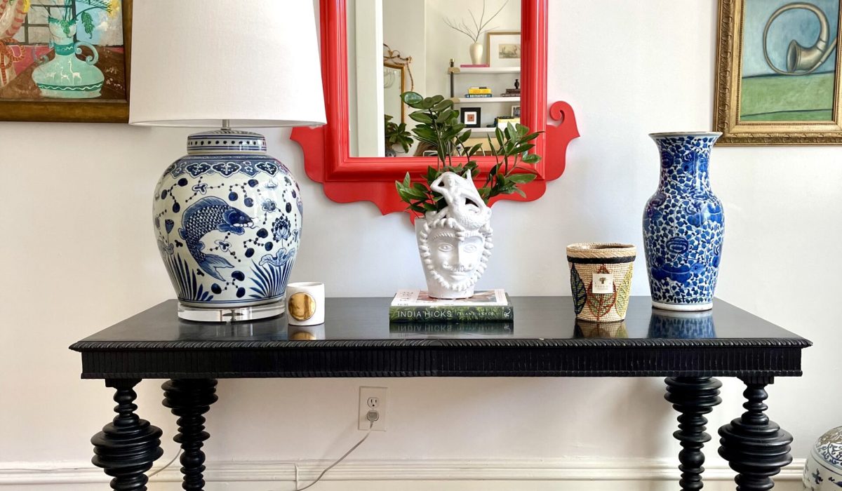 This Chinese red mirror from Oomph Home takes the lead in this Savannah foyer. Design by 1 Chic Retreat