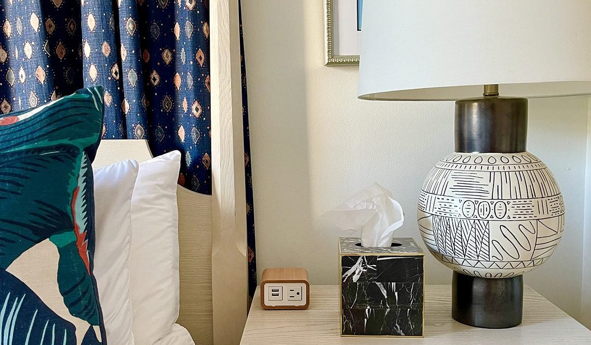 A small chic charging unit beside the bed in this Savannah carriage house pleases guests immensely.
